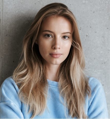 pretty-woman-standing-over-grey-wall-background-4A829TX